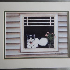 An 11 x 14 matted print of a painting called  "Lovey"